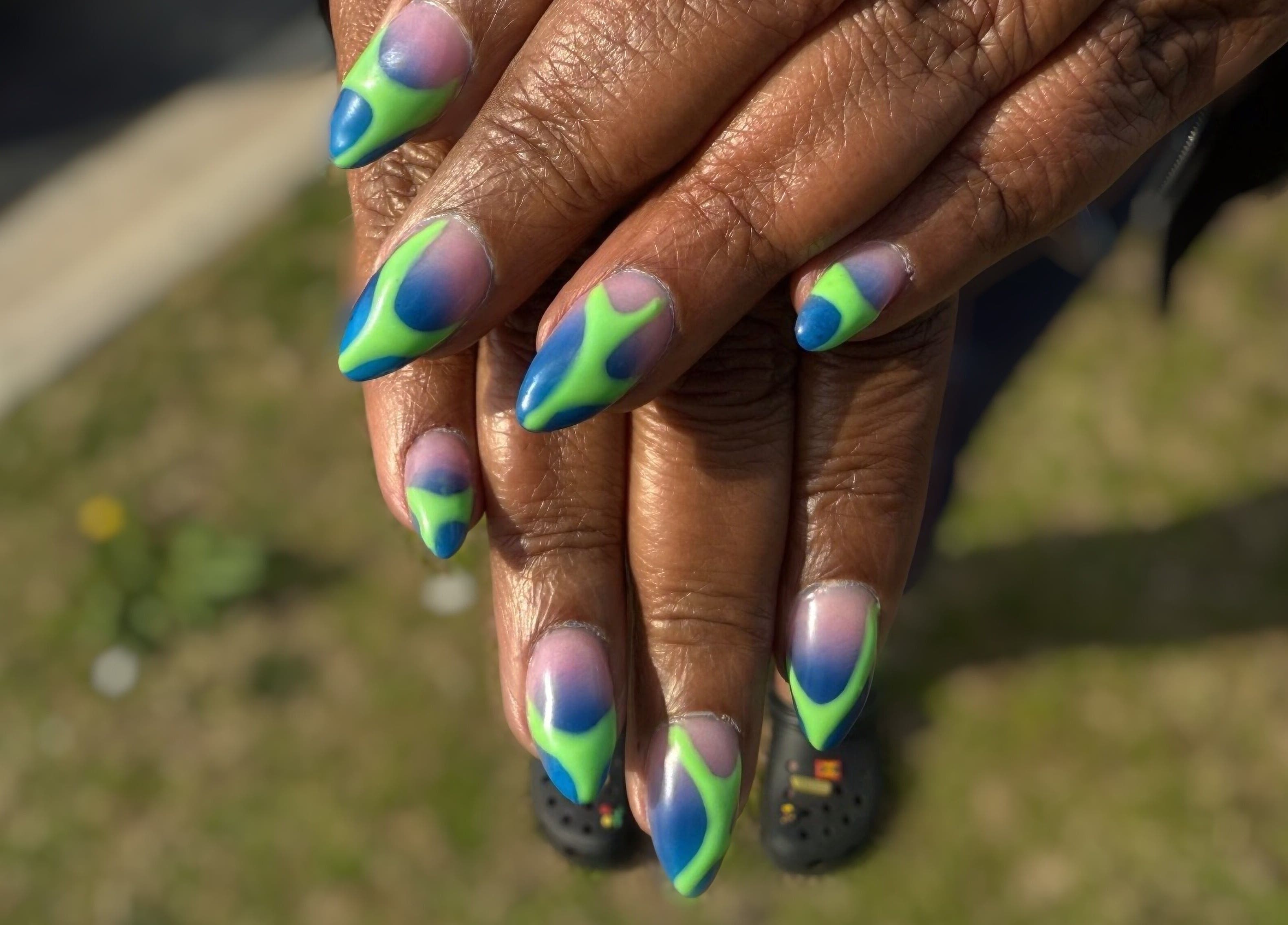 Vibrant nail art from Hart of Nails, Fayetteville, North Carolina, US, showcasing an eye-catching design.