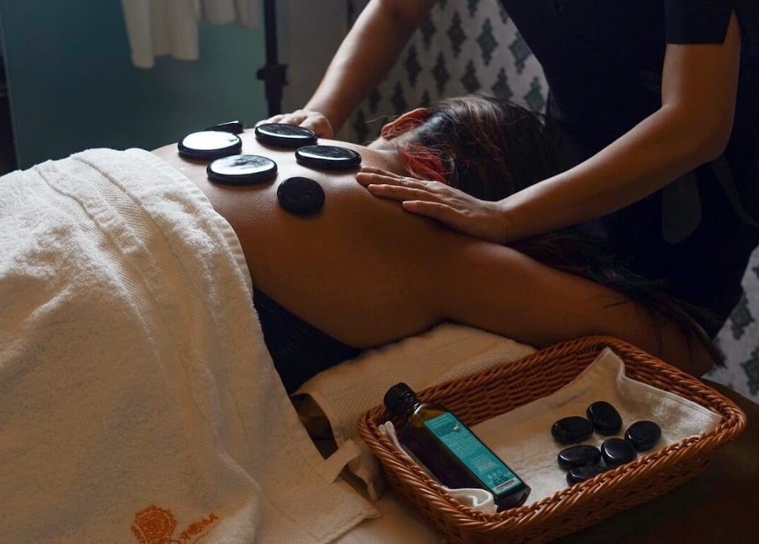 Relaxing hot stone massage at Moroccan Spa, Lucknow, Uttar Pradesh, IN, promotes wellness and relaxation.