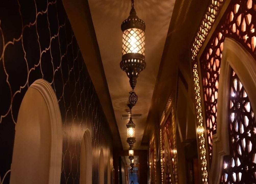 Elegant hallway with ornate lanterns at Moroccan Spa, Lucknow, Uttar Pradesh, IN.