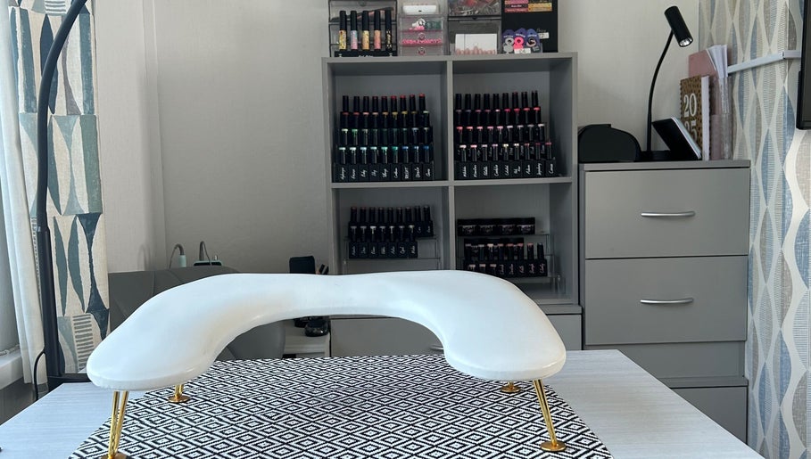 Nail care station at NailsByAmyMaree in Penzance, England, GB, featuring organized polish display.