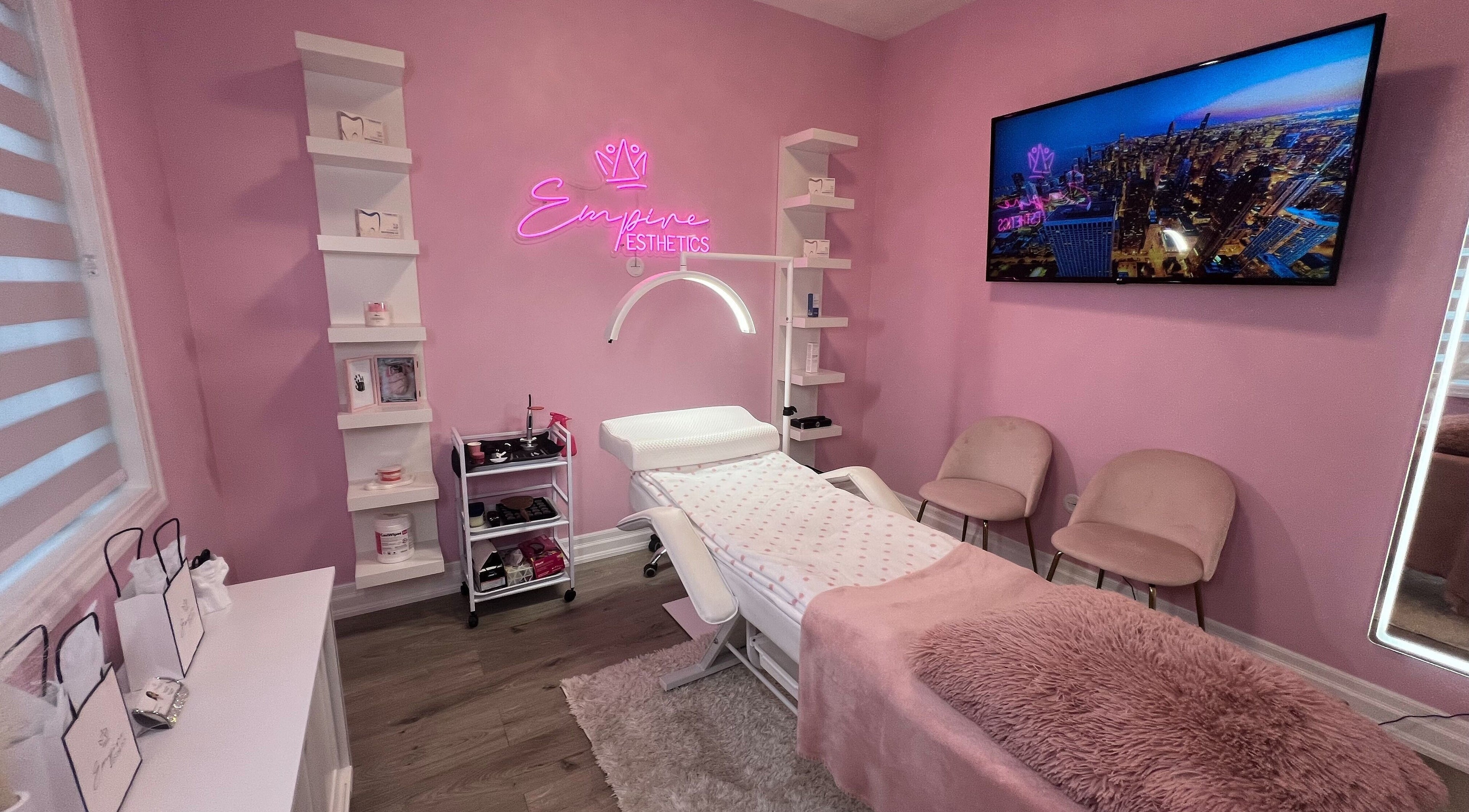 Tranquil treatment room at Empire Esthetics in Oakville, Ontario, CA, featuring a plush bed and elegant decor.