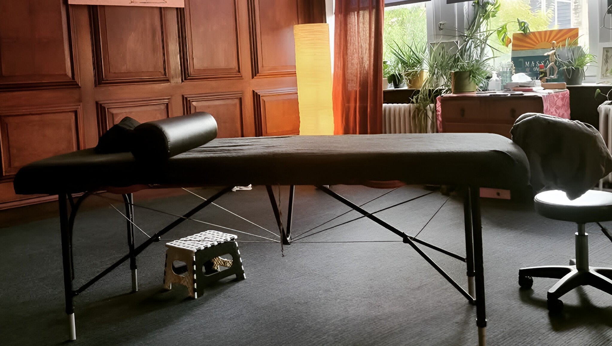 Calming therapy space at Dakota Therapies, Victorian Studio, Cardiff, GB with massage table and soft lighting.