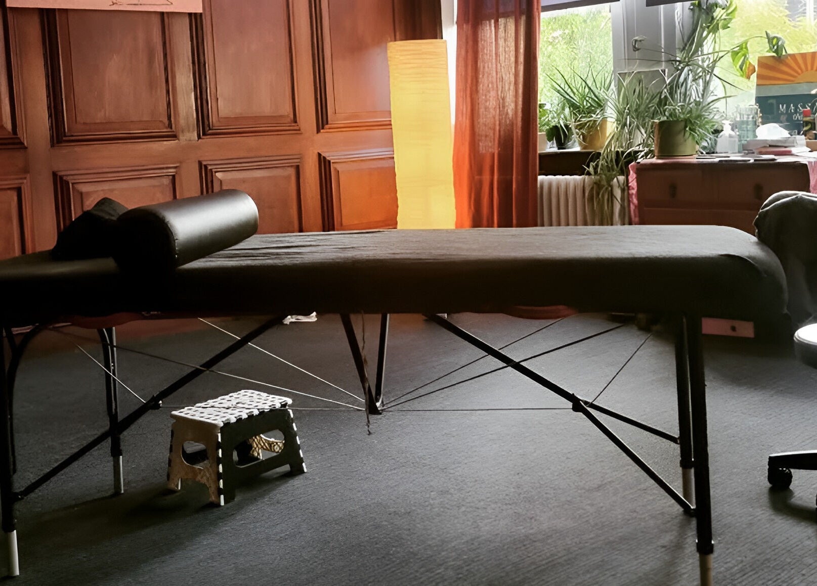 Calming therapy space at Dakota Therapies, Victorian Studio, Cardiff, GB with massage table and soft lighting.