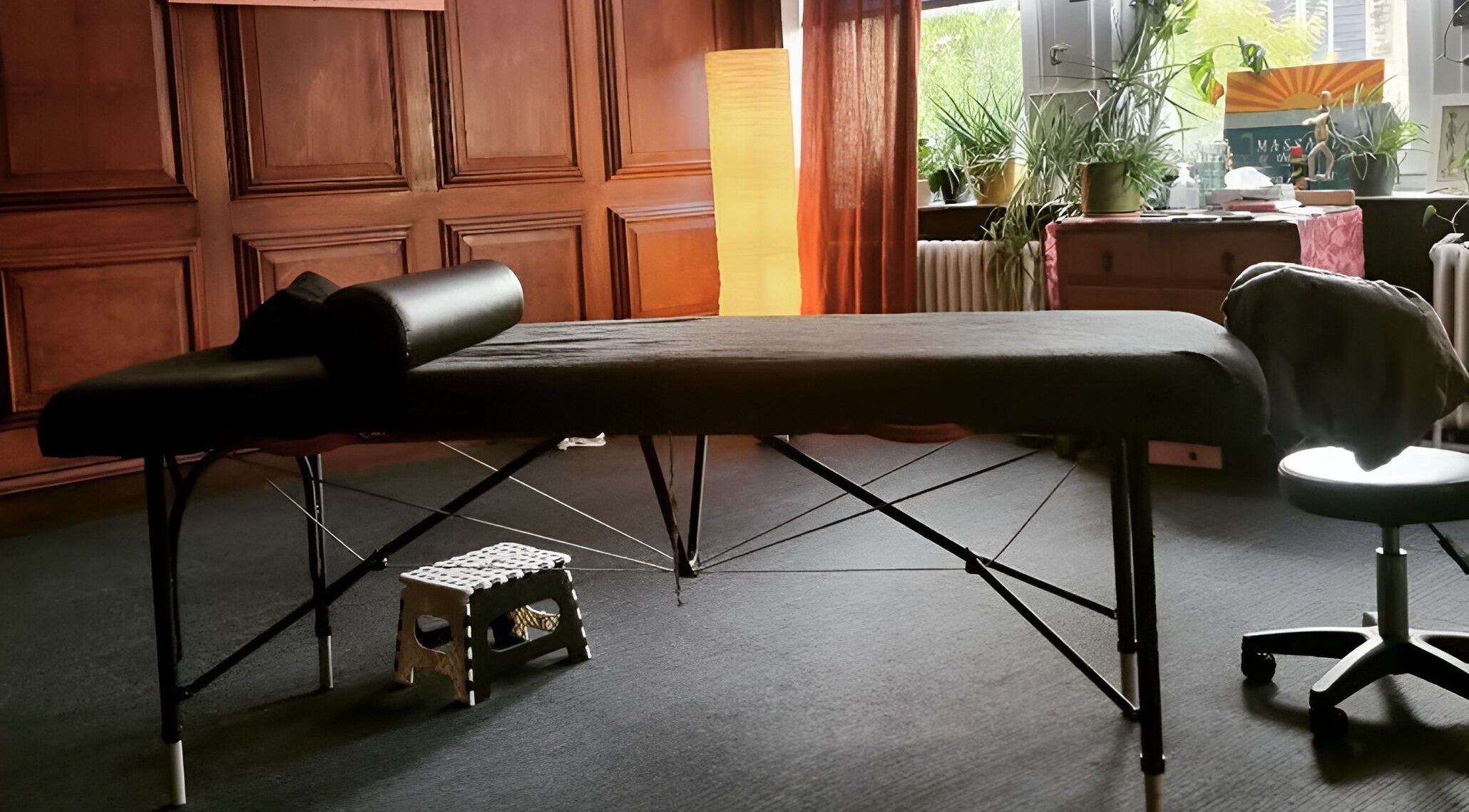 Calming therapy space at Dakota Therapies, Victorian Studio, Cardiff, GB with massage table and soft lighting.