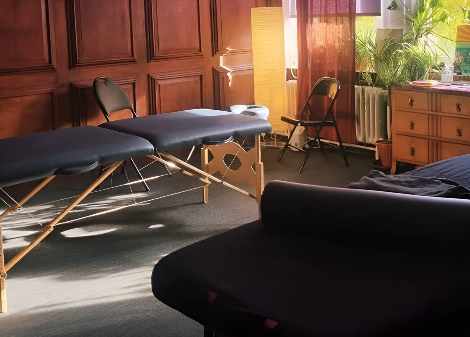 Relaxing therapy room at Dakota Therapies at Victorian Studio, Cardiff, GB with massage tables and warm lighting.