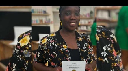 A person smiling while holding a certificate at Venetia Hair, Hitchin, England, GB.