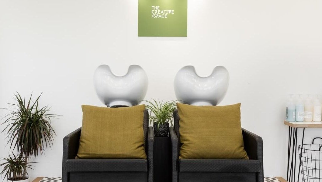 Chic wash station at Joshua Rose Hair in Creative Space Kent, Faversham, England, GB featuring stylish seating.