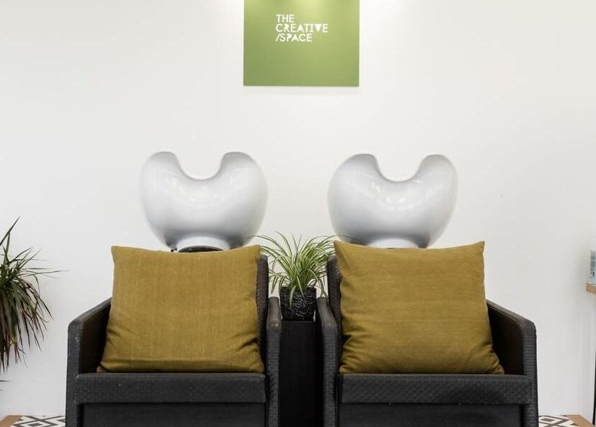 Chic wash station at Joshua Rose Hair in Creative Space Kent, Faversham, England, GB featuring stylish seating.