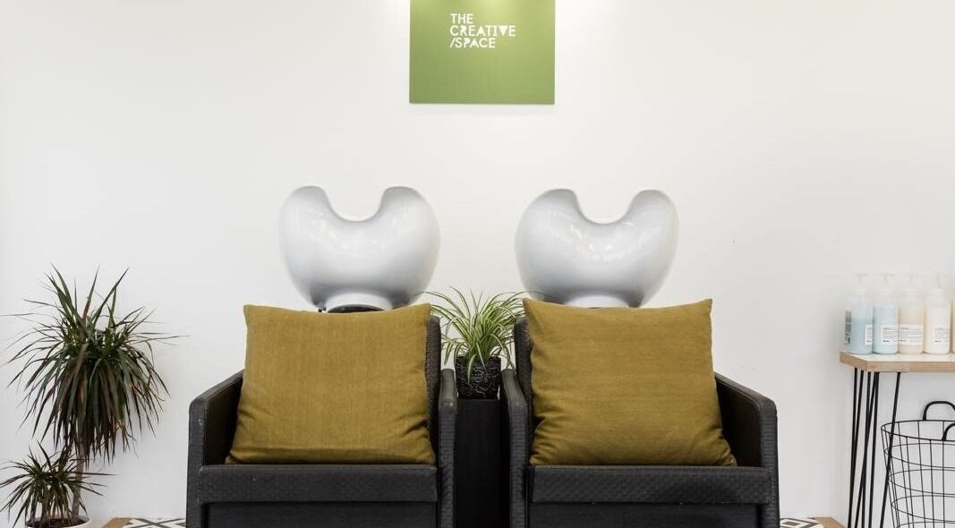 Chic wash station at Joshua Rose Hair in Creative Space Kent, Faversham, England, GB featuring stylish seating.