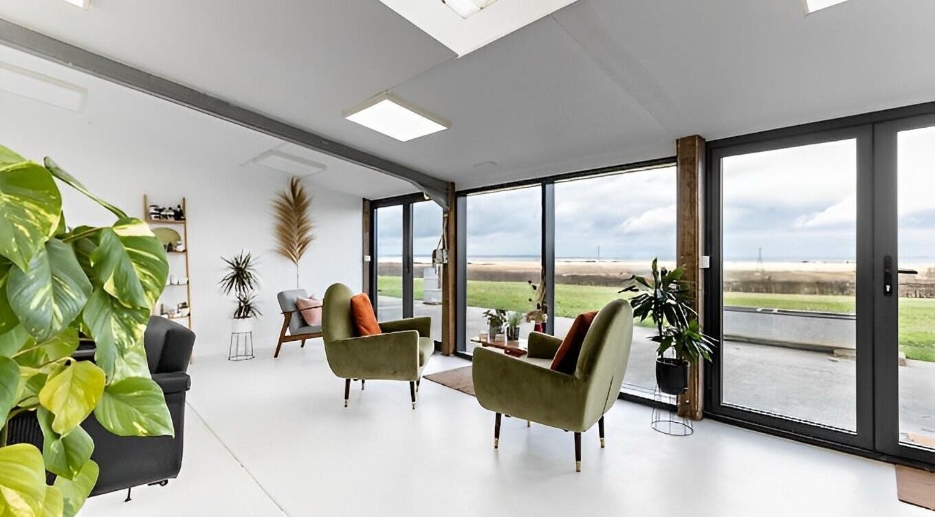 Bright, inviting lounge space at Joshua Rose Hair- Creative Space Kent, Faversham, England, GB with modern decor.