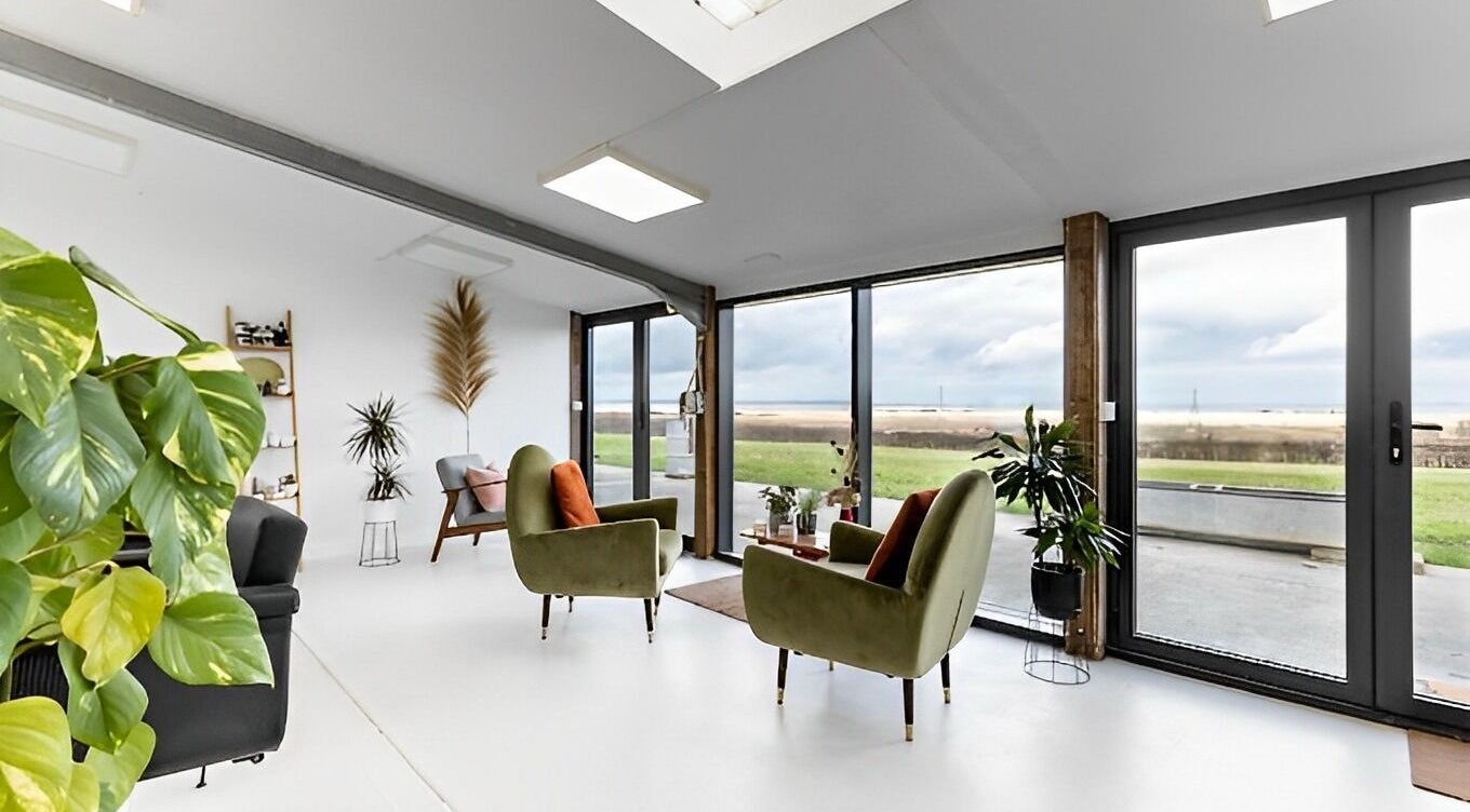 Bright, inviting lounge space at Joshua Rose Hair- Creative Space Kent, Faversham, England, GB with modern decor.