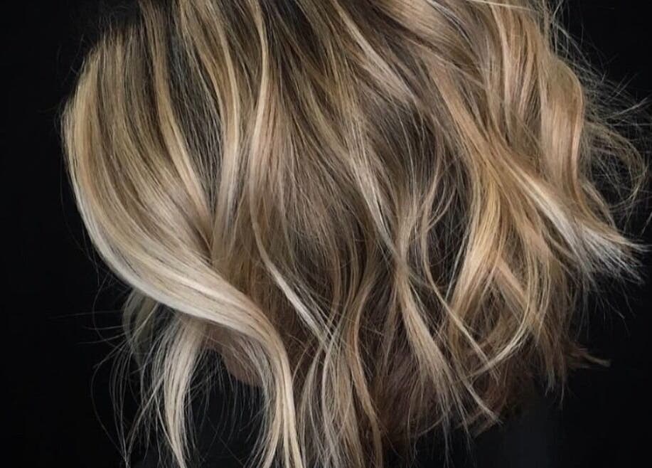 Blonde wavy hair styled at Passion Hair, London, England, GB, showcasing chic elegance and modern style.