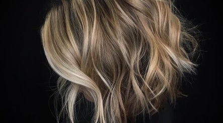 Blonde wavy hair styled at Passion Hair, London, England, GB, showcasing chic elegance and modern style.