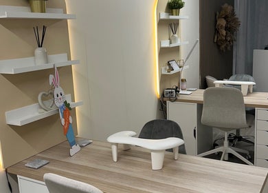 Modern manicure station at Luxe Enhancements in Rochester, England, GB with sleek design and subtle lighting.