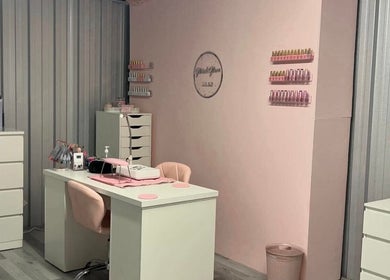 Elegant Glitz&GlamNailBar studio in Winsford, England with modern pink and white decor.