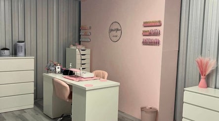Elegant Glitz&GlamNailBar studio in Winsford, England with modern pink and white decor.