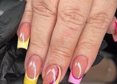 Colorful nail art design at Glitz&GlamNailBar, Winsford, England, GB, showcasing vibrant manicure styles.