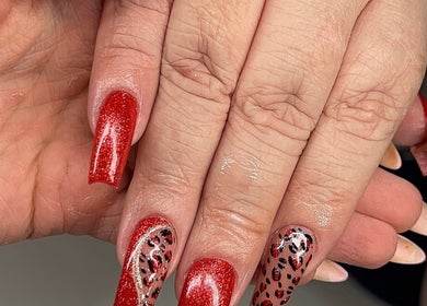 Elegant red and leopard nail art at Glitz&GlamNailBar, Winsford, England, GB.