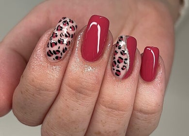 Stylish leopard print nails at Glitz&GlamNailBar, Winsford, England, GB. Perfect blend of chic design and bold color.