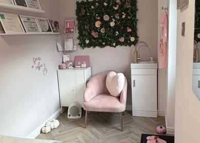 Elegant beauty corner at Aglow by VL, Essington, England, GB, featuring plush chair and floral decor.