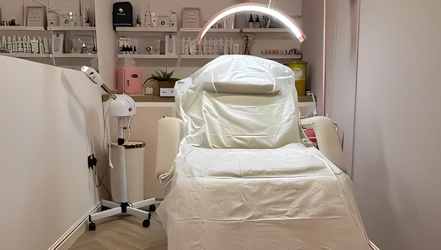Modern treatment room at Aglow by VL, Essington, England, GB, featuring a luxurious spa bed and ambient lighting.