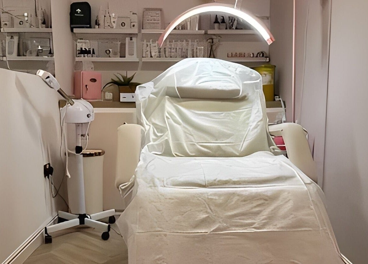 Modern treatment room at Aglow by VL, Essington, England, GB, featuring a luxurious spa bed and ambient lighting.