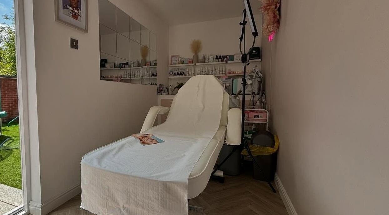 Relaxing treatment room at Aglow by VL in Essington, England, GB with comfortable chair and calming decor.