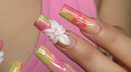 Colorful floral nail art at Pressed Beans in Montréal, Québec, CA, showcasing intricate 3D designs.