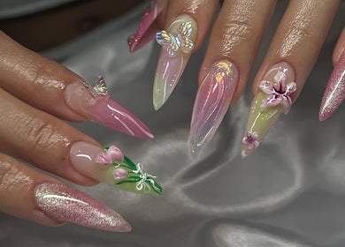 Exquisite floral nail art at Pressed Beans, Montréal, Québec, CA. Vibrant butterfly details.