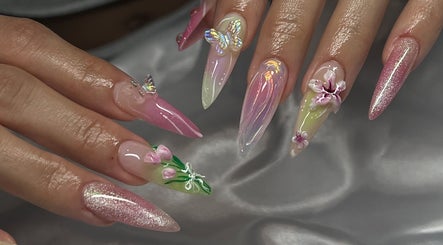 Exquisite floral nail art at Pressed Beans, Montréal, Québec, CA. Vibrant butterfly details.
