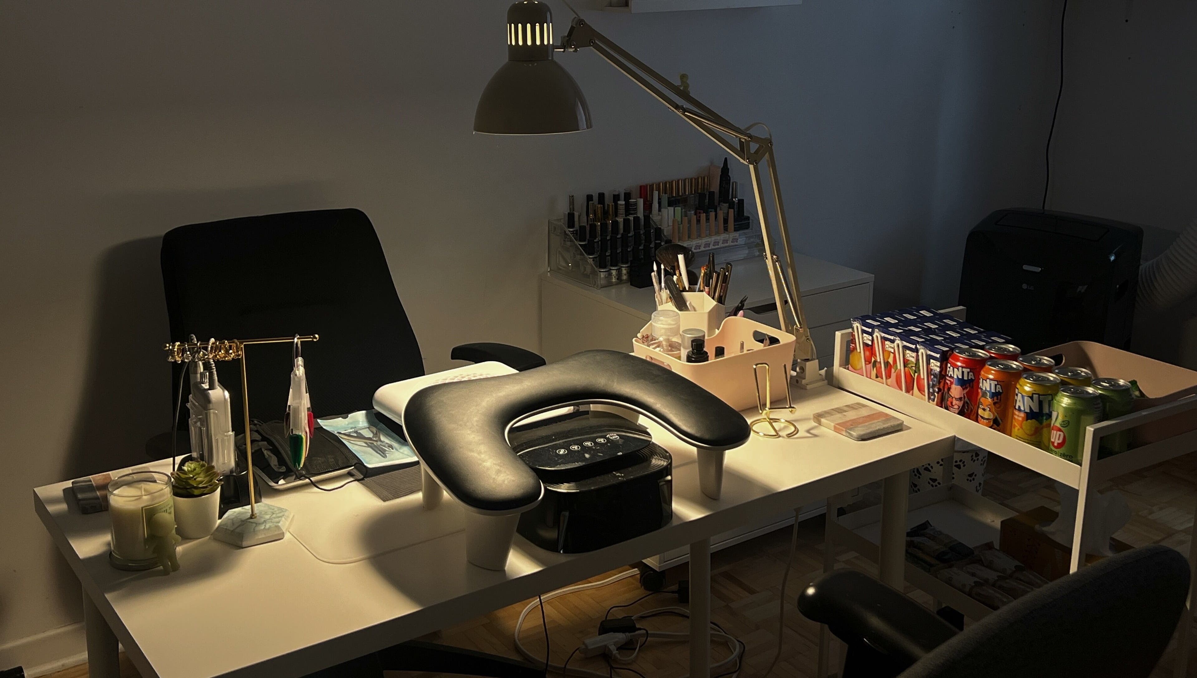Nail care workspace at Pressed Beans, Montréal, Québec, CA, equipped with tools, products, and seating.