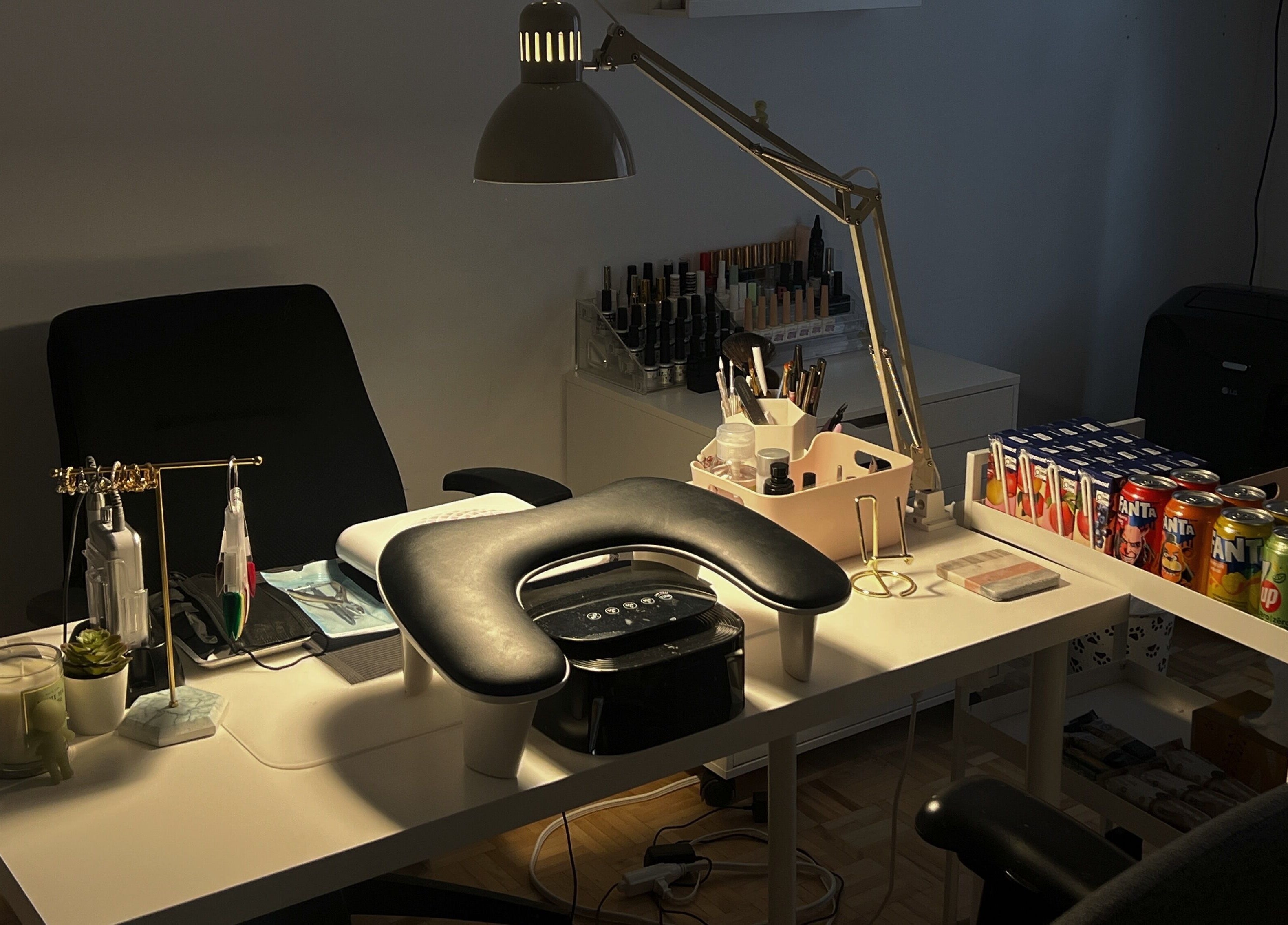 Nail care workspace at Pressed Beans, Montréal, Québec, CA, equipped with tools, products, and seating.