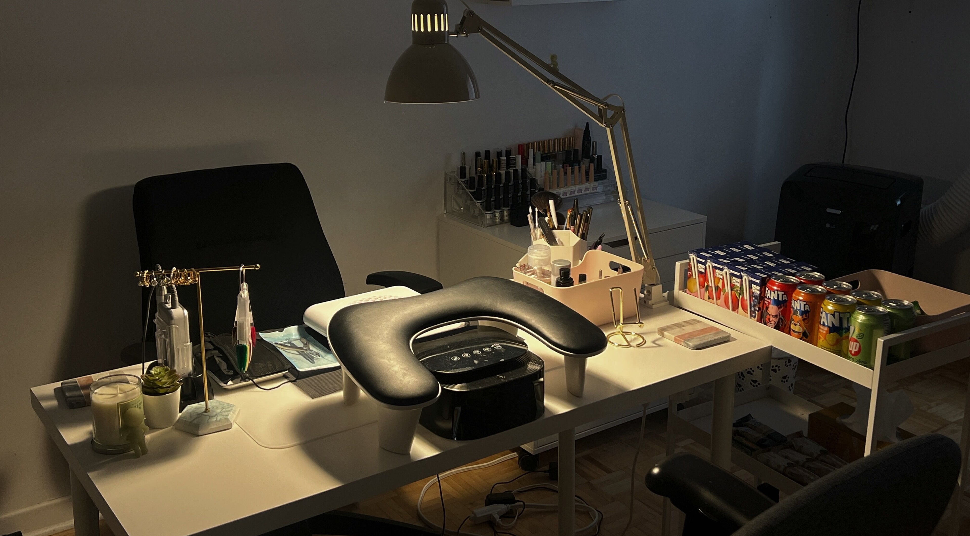 Nail care workspace at Pressed Beans, Montréal, Québec, CA, equipped with tools, products, and seating.