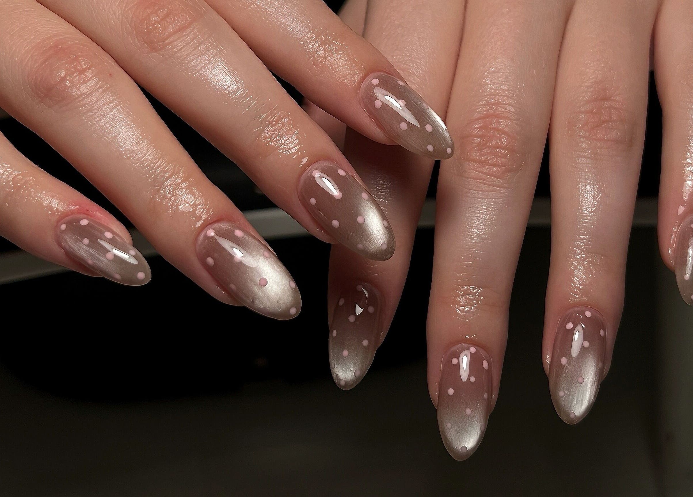 Stylish polka dot nails at Pressed Beans, Montréal, Québec, CA, showcasing modern nail art.