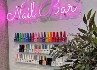 Gracie’s Nail Lab nail polish display under neon sign in West Bromwich, England, GB.