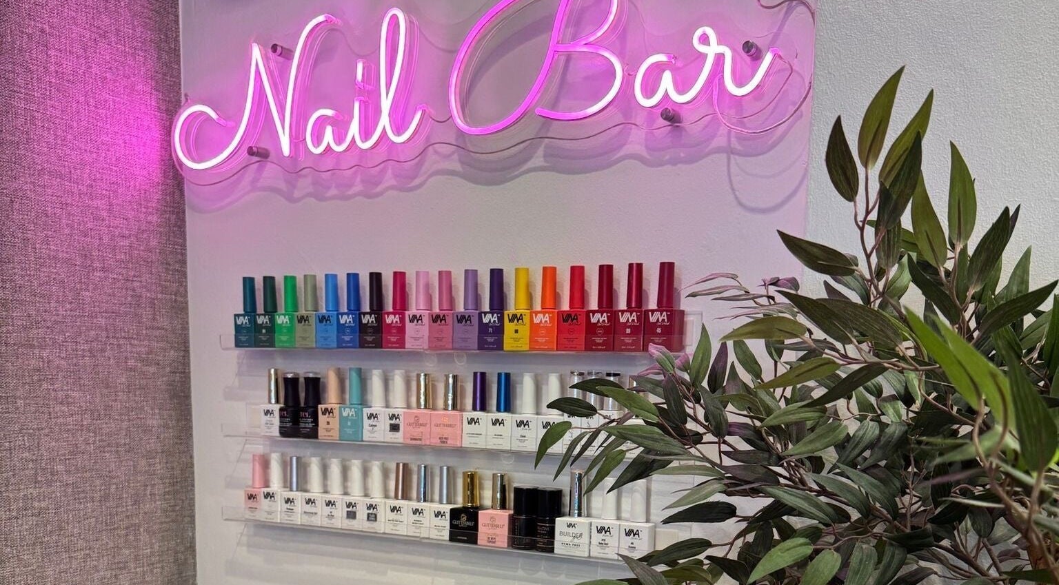 Gracie’s Nail Lab nail polish display under neon sign in West Bromwich, England, GB.