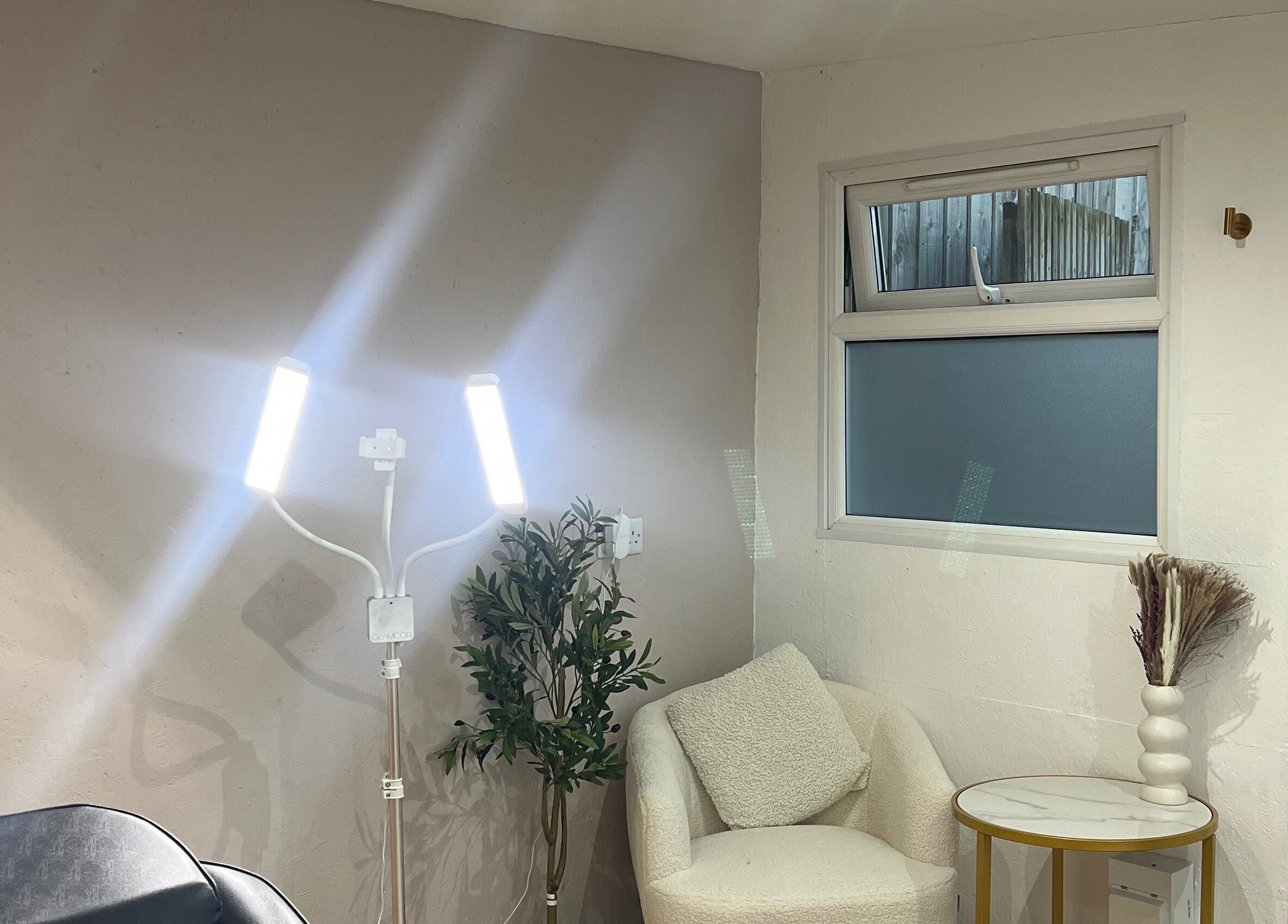 Inviting beauty corner at Tiffany’s Brows and Beauty, Northam, England, GB. Modern lighting and seating setup.