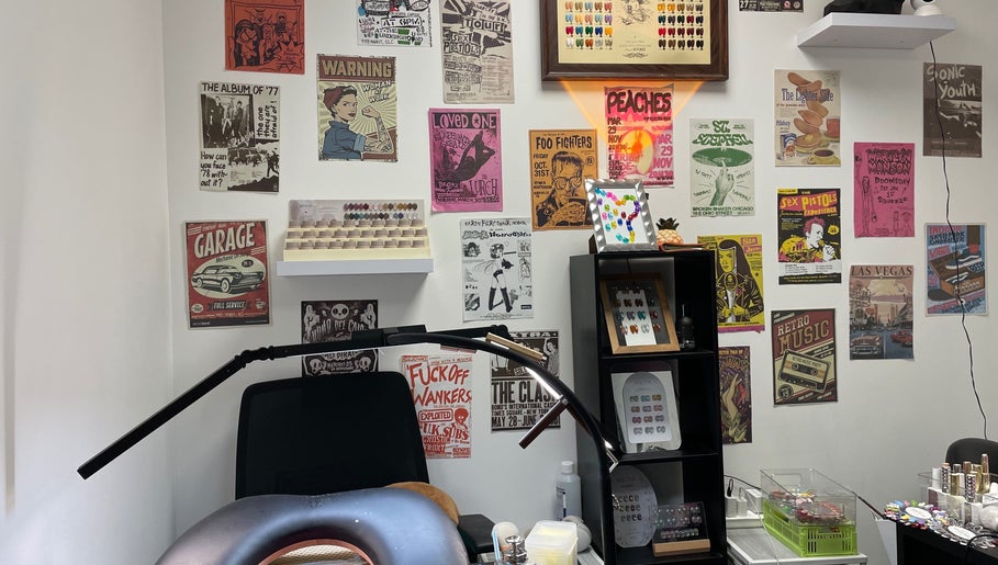 Eclectic retro nail salon interior at Pineapple Chunks Nail, Manchester, England, GB, showcasing vibrant posters.