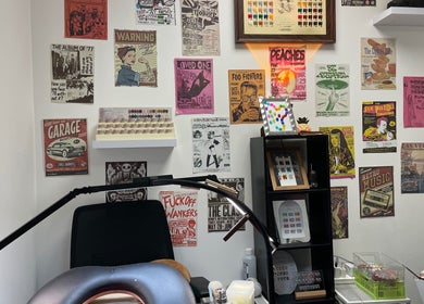 Eclectic retro nail salon interior at Pineapple Chunks Nail, Manchester, England, GB, showcasing vibrant posters.