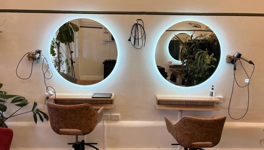 Chic salon chairs and mirrors at Olive For Hair, Mount Barker, Western Australia, AU highlighting modern style.
