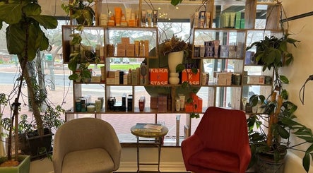 Shelves with beauty products at Olive For Hair, Mount Barker, Western Australia, AU, create a calming atmosphere.