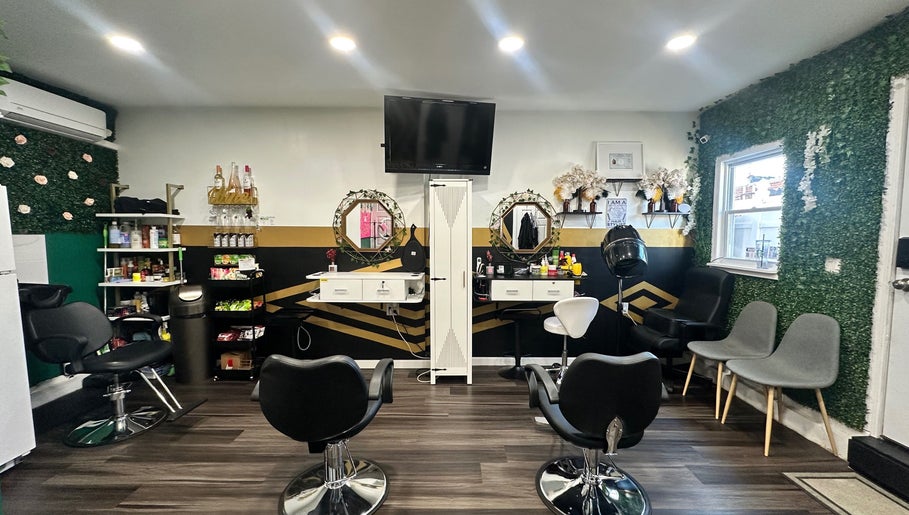 Modern salon interior at Laid Gracefully LLC, New York, New York, US with stylish chairs, mirrors, and decorative walls.