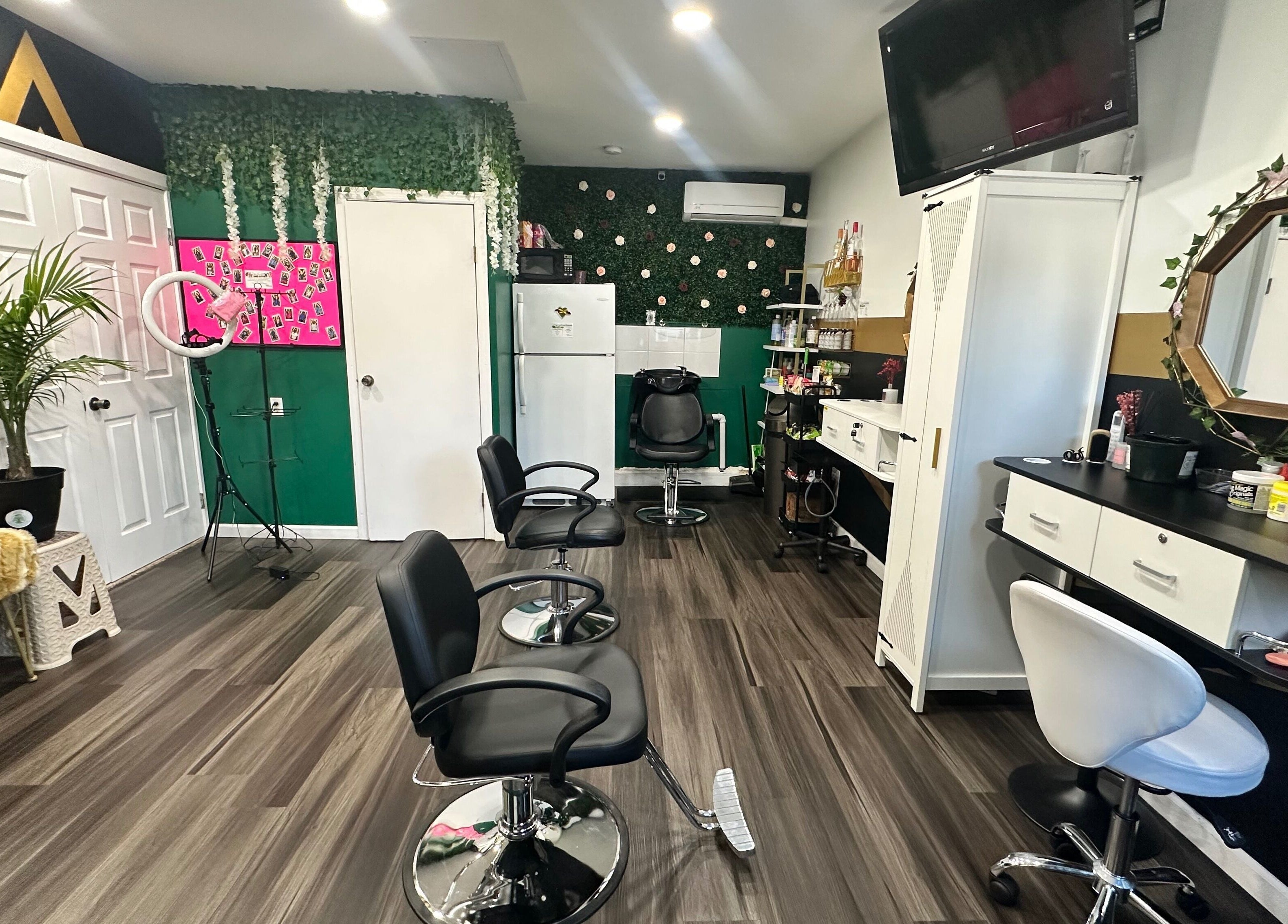 Modern salon interior at Laid Gracefully LLC, New York, New York, US featuring chic chairs and vibrant decor.