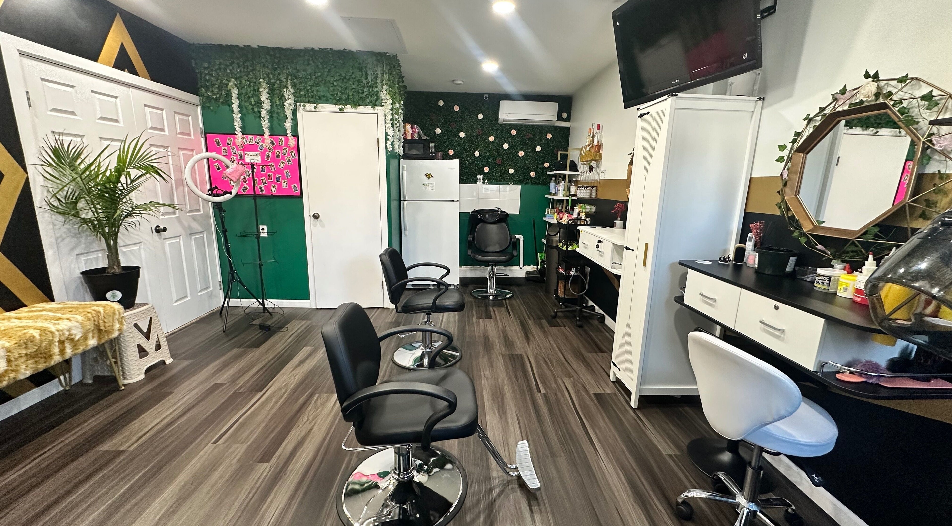 Modern salon interior at Laid Gracefully LLC, New York, New York, US featuring chic chairs and vibrant decor.
