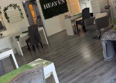 Chic interior of Dew Skin Aesthetics, Heswall, England, featuring modern decor and plush seating.