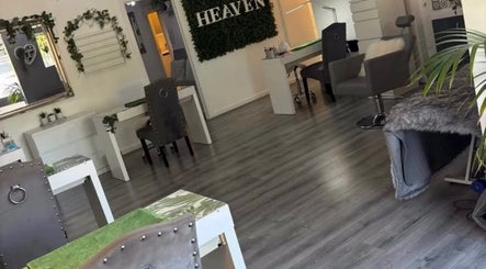 Chic interior of Dew Skin Aesthetics, Heswall, England, featuring modern decor and plush seating.