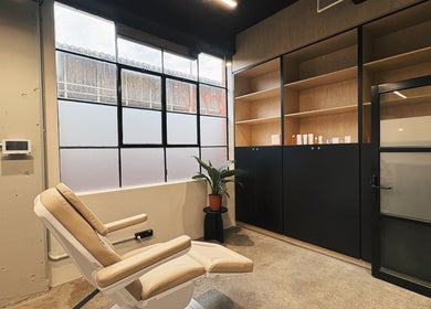 Calm treatment room at Bespoke Aesthetics by Sammy, Melbourne, Victoria, AU, featuring reclining chair and plants.