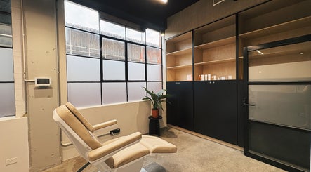 Calm treatment room at Bespoke Aesthetics by Sammy, Melbourne, Victoria, AU, featuring reclining chair and plants.