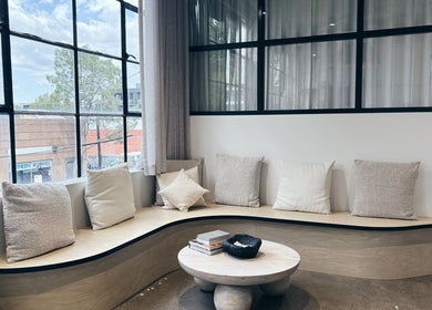 Elegant seating area at Bespoke Aesthetics by Sammy in Melbourne, Victoria, AU, featuring plush cushions and natural light.