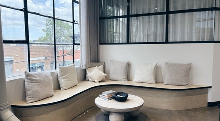 Elegant seating area at Bespoke Aesthetics by Sammy in Melbourne, Victoria, AU, featuring plush cushions and natural light.